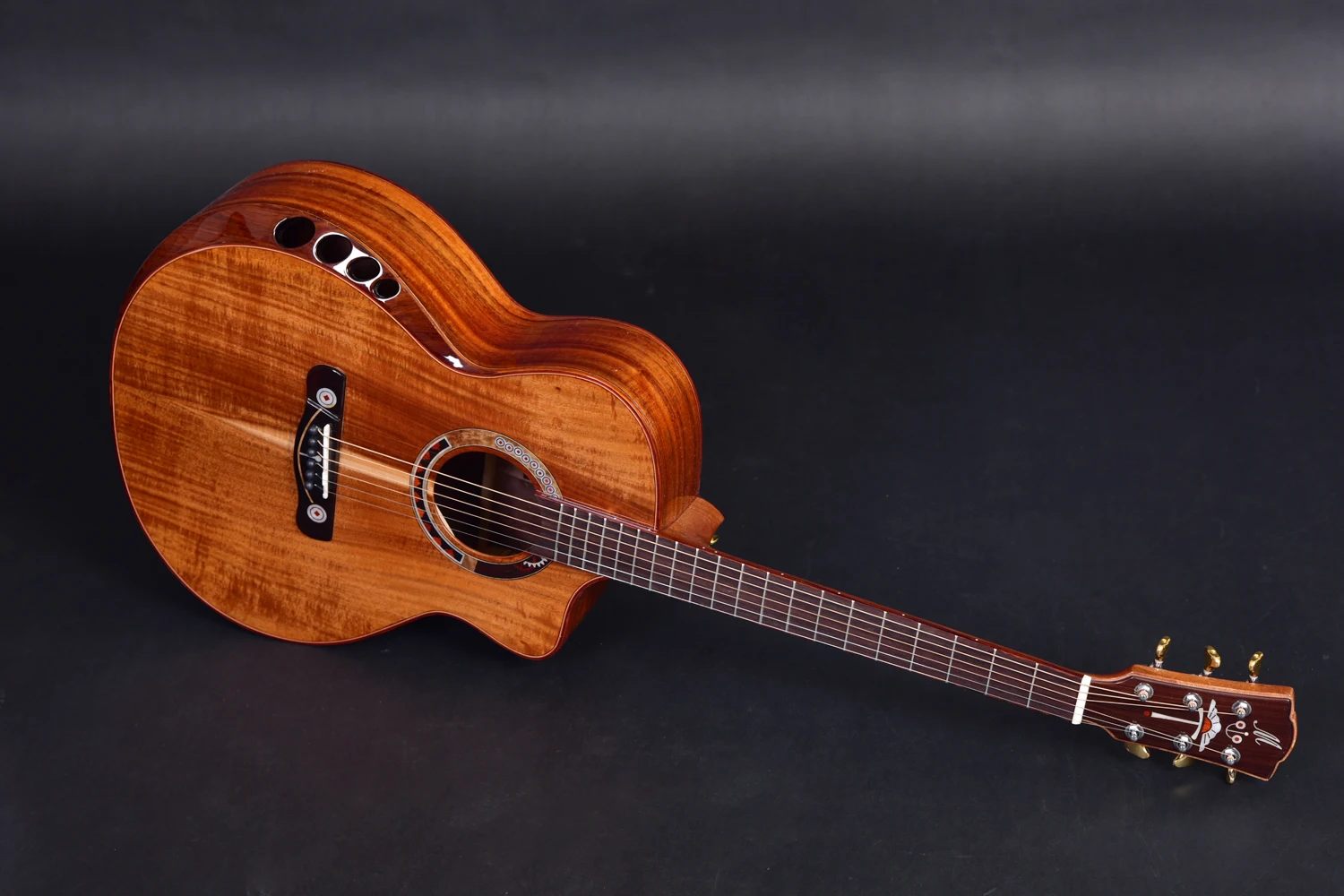 Solid wood acoustic guitar with customized design for rich sound and personalized playing experience