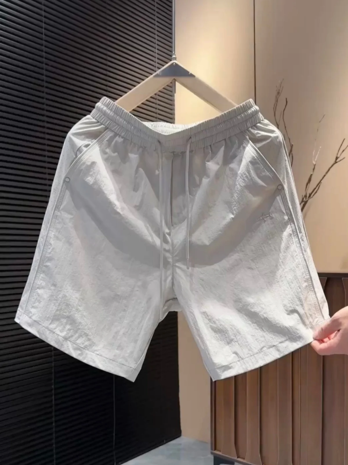 

Men's Summer Casual Ice Silk Quick Dry Breathable Mesh Short Pants Fashionable Five-Quarter Length Sporty Loose Fit Polyester...