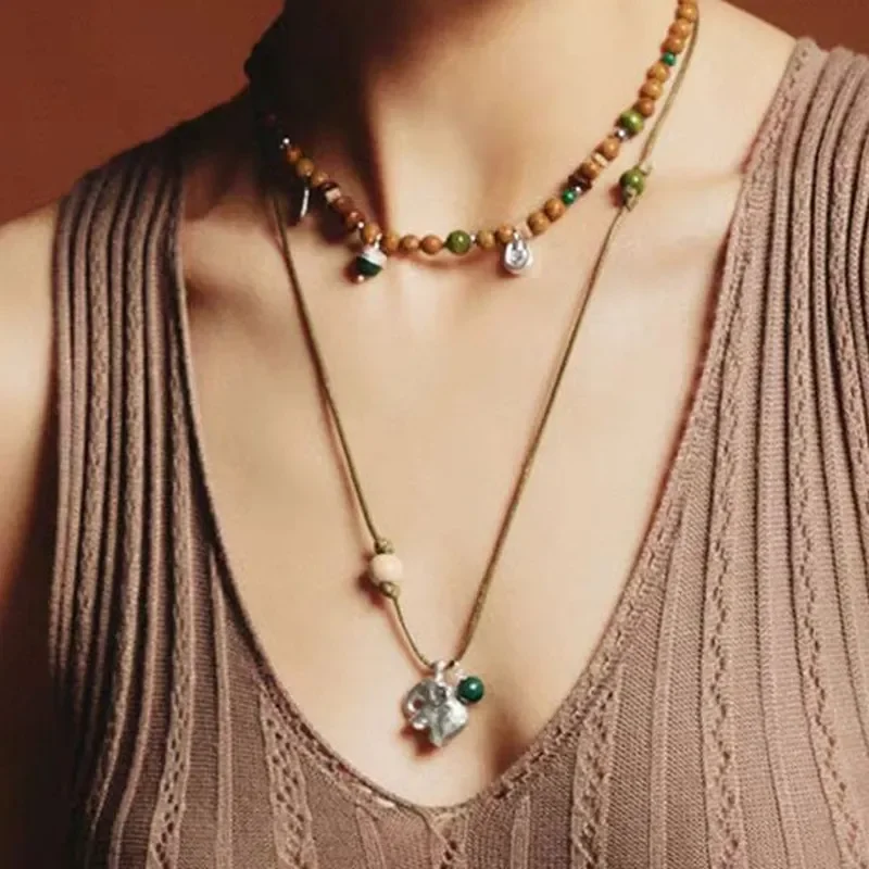 Niche design high-end baby elephant necklace women's retro versatile totem necklace green pattern stone beaded long sweater