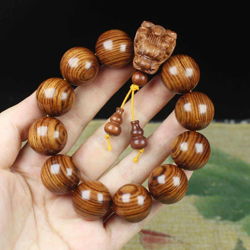 

Браслет из палисандра и красного дерева с резной головой дракона и зелеными бусинами, буддийский браслет из тигрового дерева и сандалового дерева.