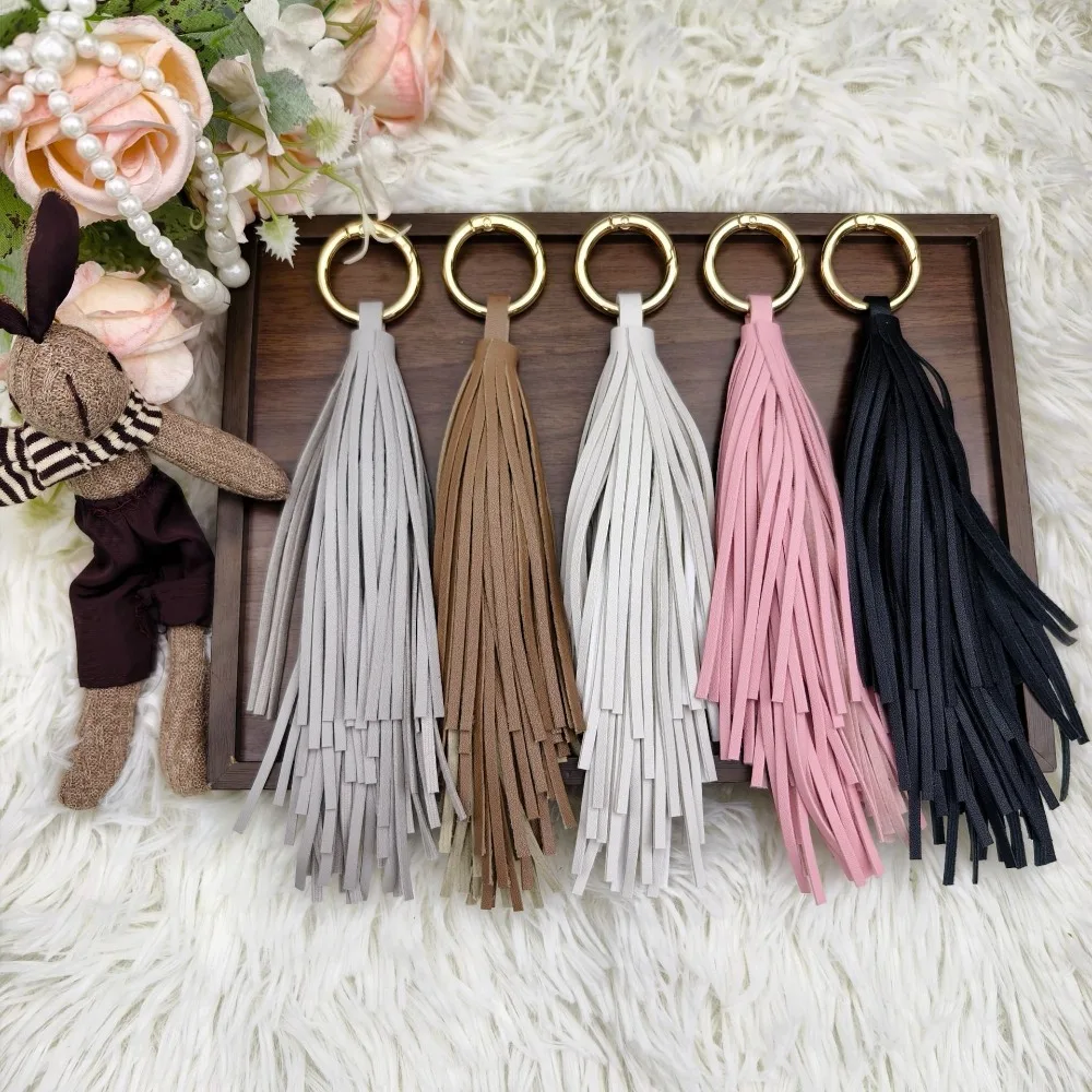 

PU Leather Tassel Spike Keychain Luggage Fashion Bag Keyring Home Textile Spike Manufacturer Popular Key Chain Pendant Gift