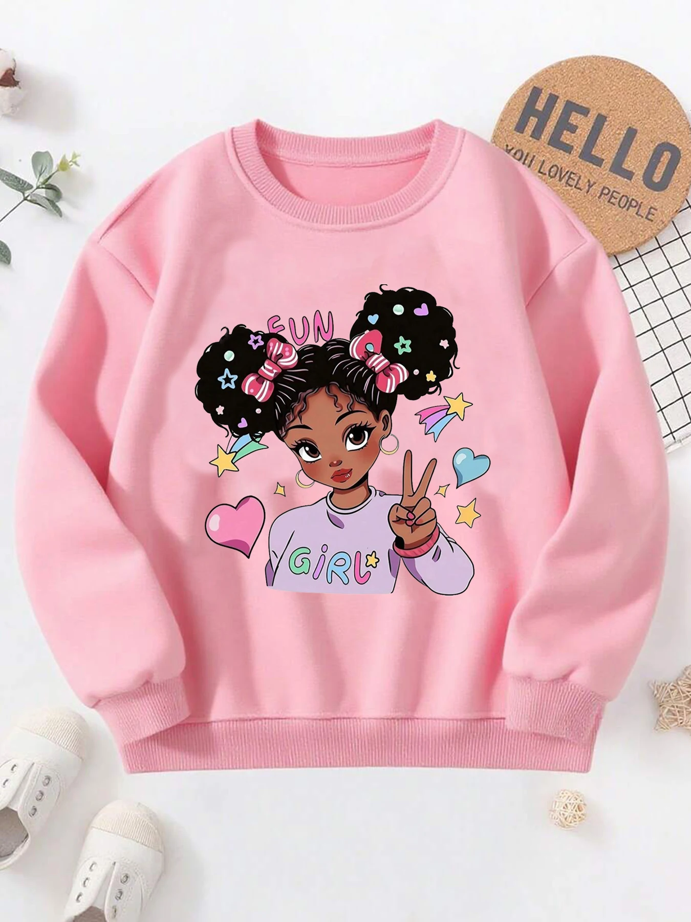 Girls' pink long-sleeve crew-neck sweatshirt featuring a 