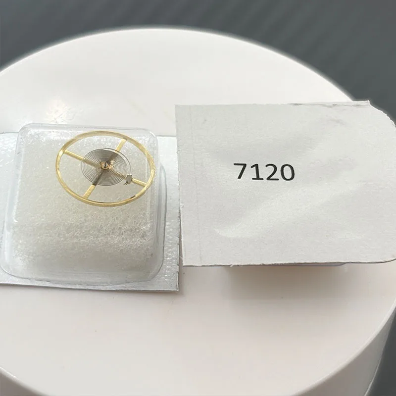 Watch accessories, including the entire movement of the 7120 caliber with hairspring, and the complete balance wheel of the 7120
