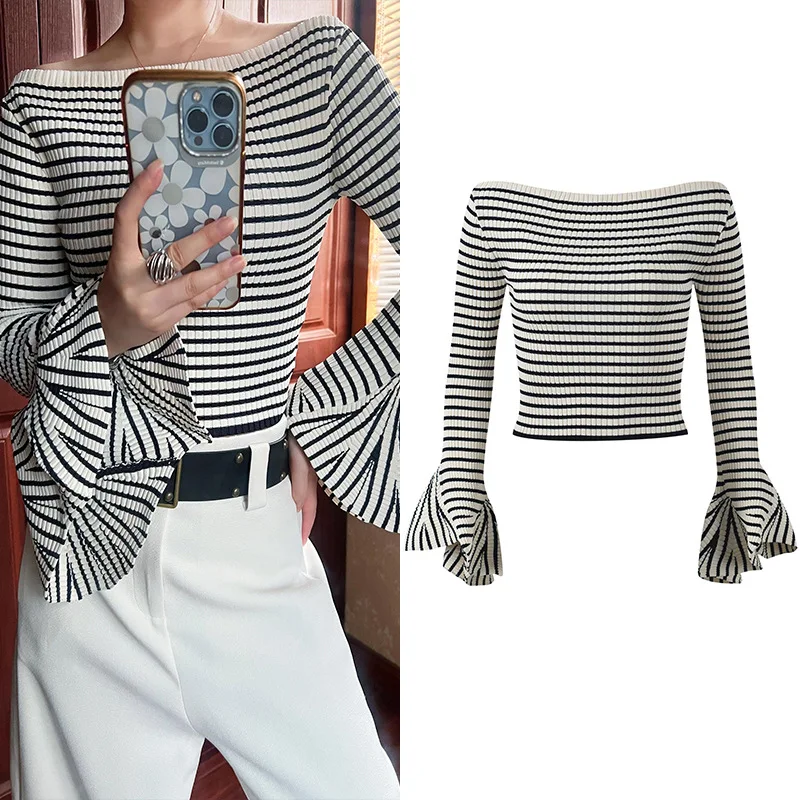 Black and white striped sweater with a line neck and flared sleeves