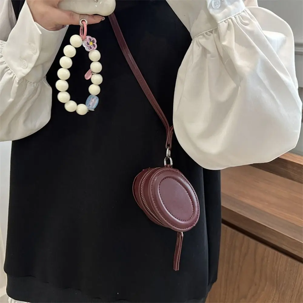 

Elegant PU Leather Hanging Neck Coin Purse with Makeup Mirror Oval Earphone Bag Round Korean Style Crossbody Bag Travel