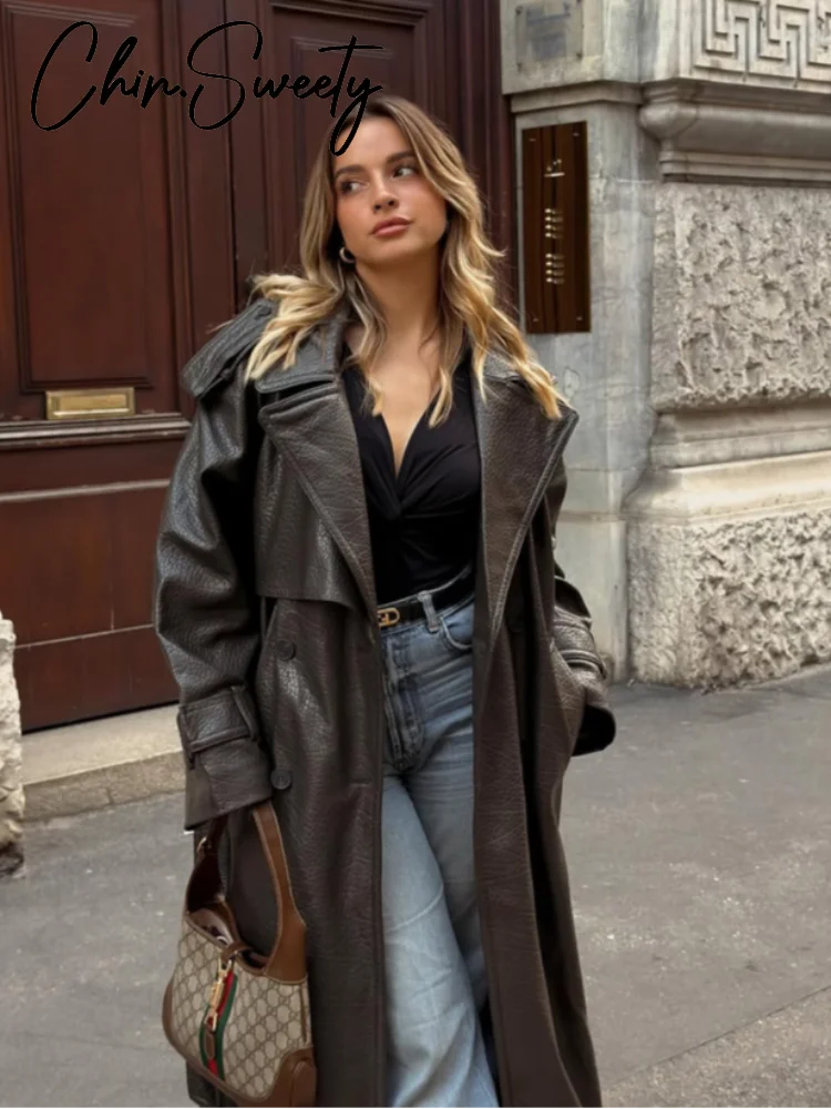 الشارع بولي Leather جلد المرأة معطف طويل موضة كم طويل زر حزام التلبيب جيب الإناث أبلى 2025 الخريف الشتاء سترة حريمي جديد