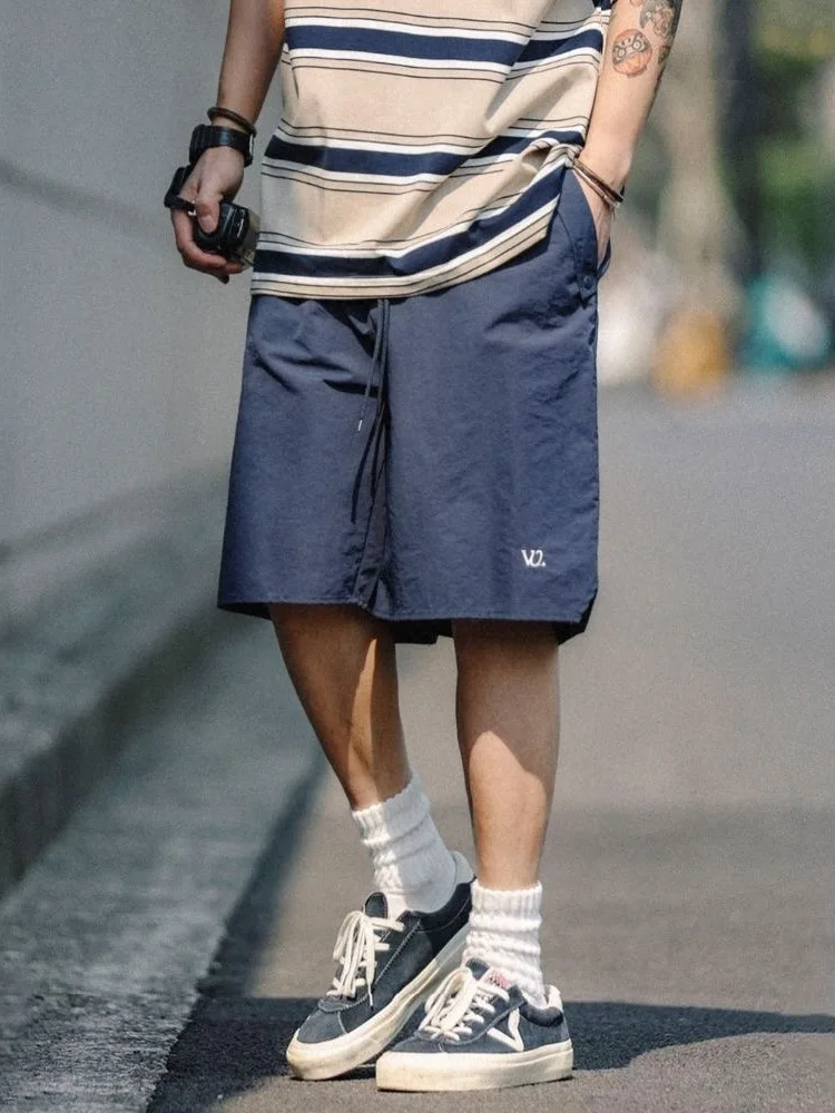 

Летние свободные повседневные быстросохнущие шорты для мужчин, спортивные брюки средней длины для пляжа и езды на велосипеде, модные молодежные городские штаны