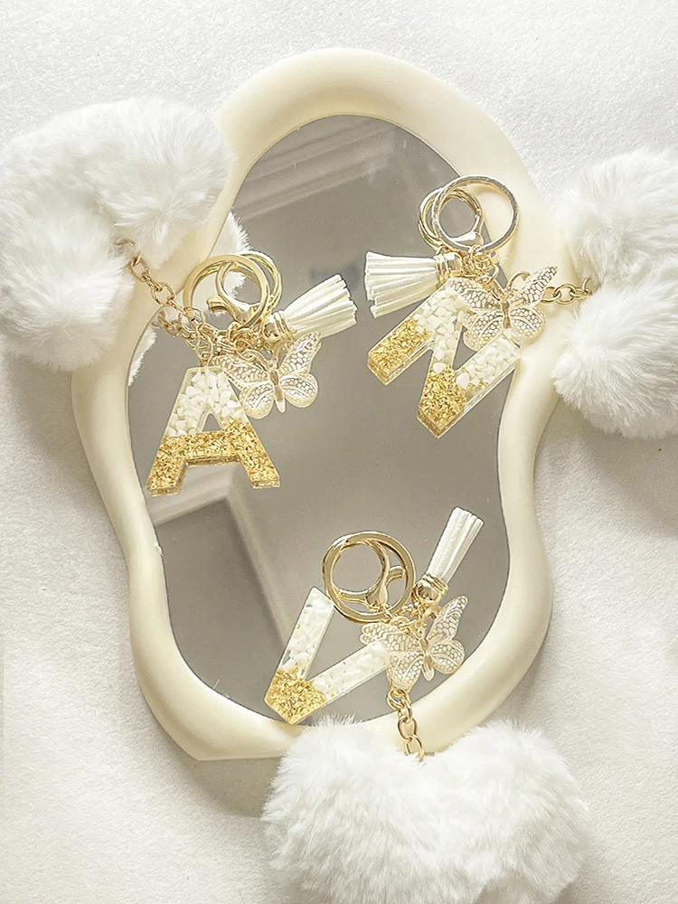English Initial letter Crystal Dropper Resin Butterfly Tassel Key Chain White Plush Peach Heart Key Ring Backpack Pendant ﻿ ﻿ ﻿