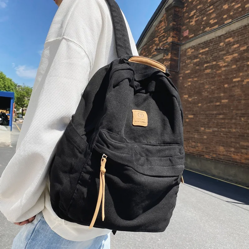 Japanese Niche Retro Lazy Wind Pendant Feeling Backpack Female Washed Canvas Schoolbag Casual College Student Class Backpack