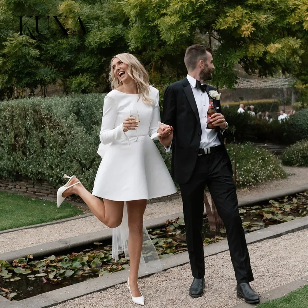 KUXA Elegantes A-Linien Brautkleid mit Schleife, O-Ausschnitt, Langen Ärmeln, Offenem Rücken und Falten, Maßgeschneidertes Hochzeitskleid 2026