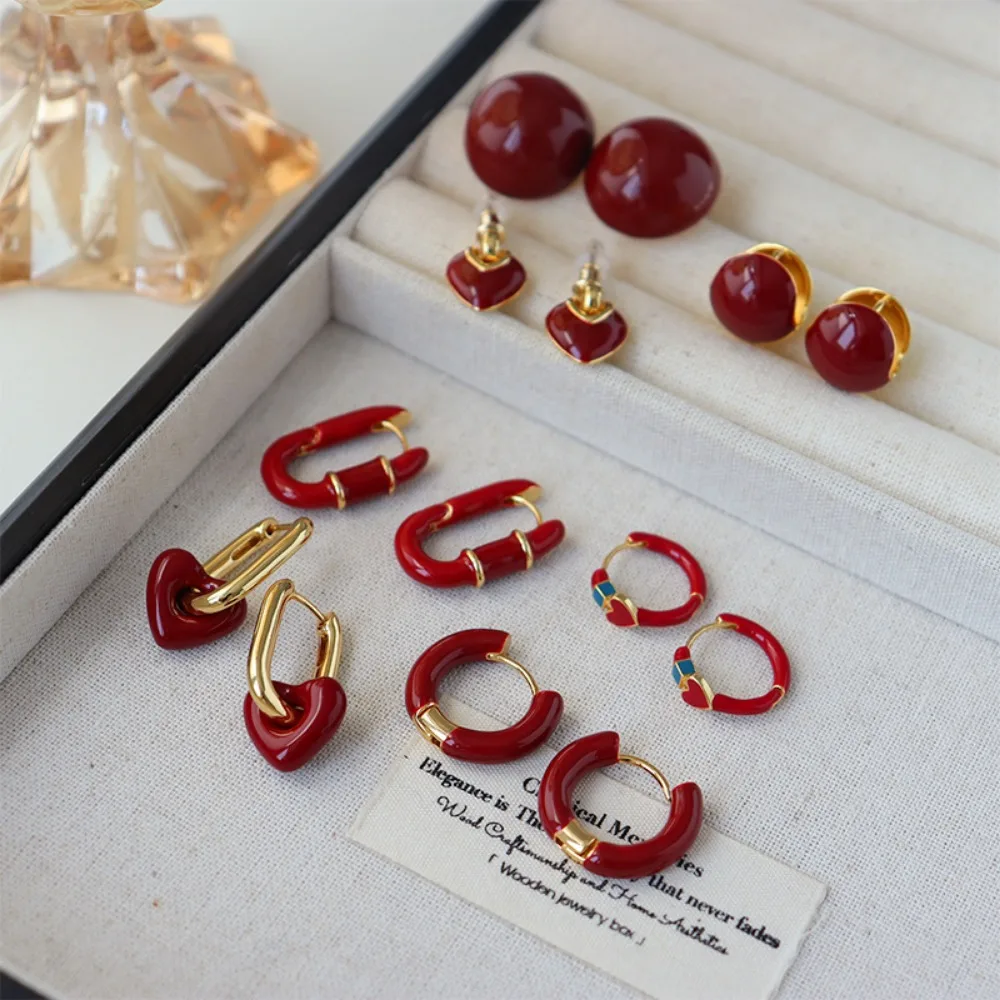 2026 السنة الجديدة الخريف الشتاء الأحمر النفط إسقاط أقراط ، موضة تنوعا الرجعية ضوء الفاخرة مكعب الزركون هوب القرط هدية الكريسماس #4