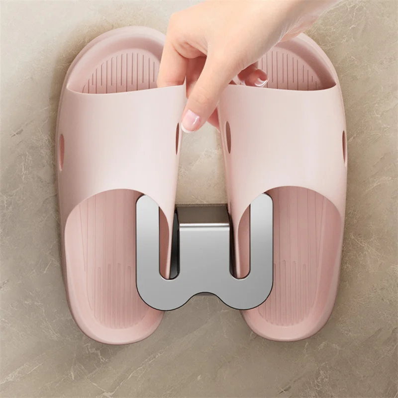 Estante de zapatillas autoadhesivo para baño, estante de drenaje de inodoro, gancho de almacenamiento de dormitorio montado en la pared, estante de secado de zapatos Simple