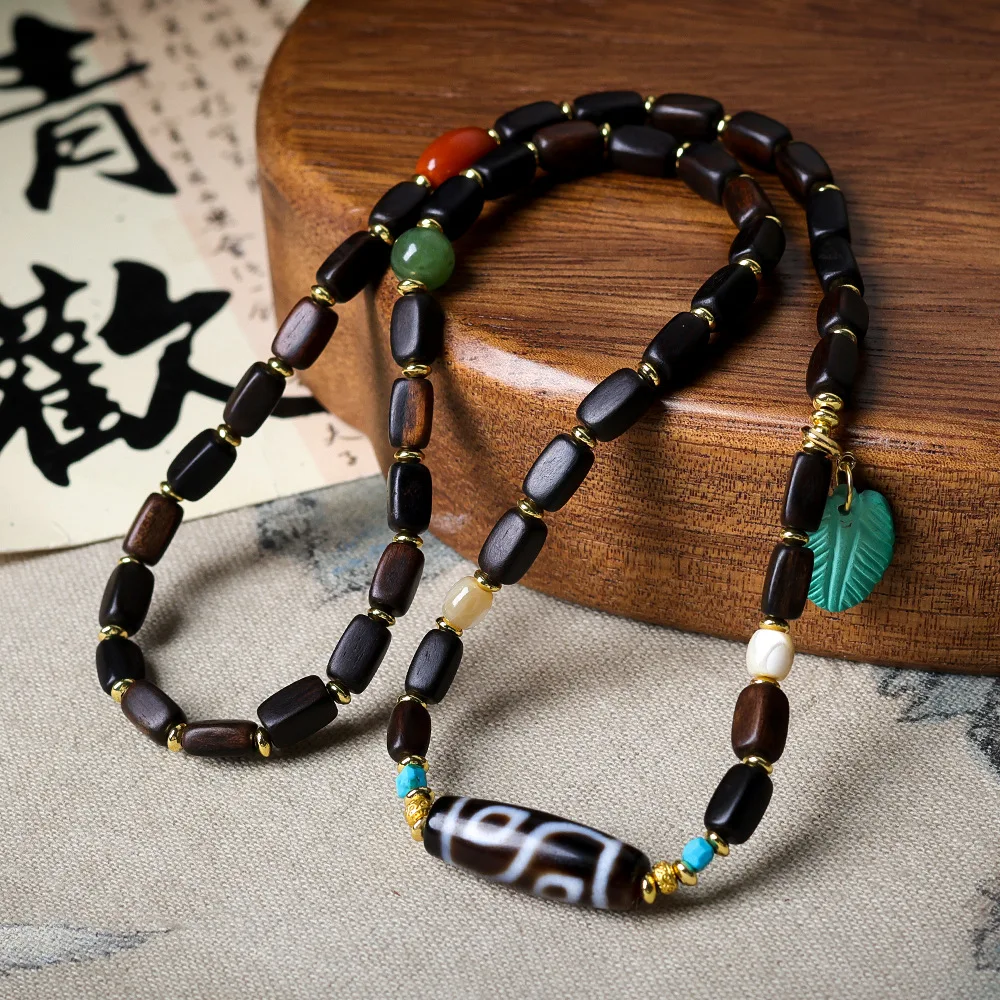 

Darakan incense wood multi-loop bracelet Mandarin magnesite turquoise feather Chinese strings necklace