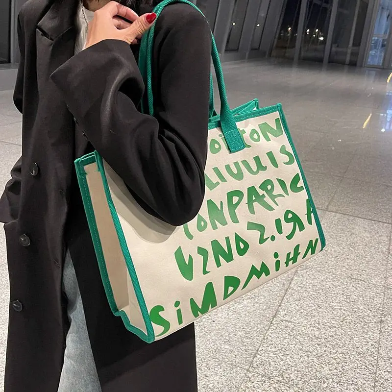 

2024 New Large Capacity Women's Ins Match Everything Fashion Canvas Zipper One-shoulder Printed Tote Car Sewing Commuter Bag