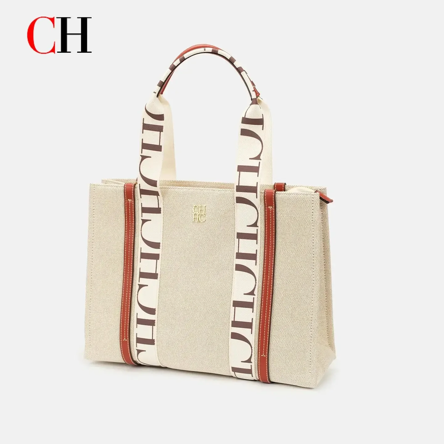 

Сумка-тоут из холщовой ткани с монограммой CH, фирменными верхними ручками, золотым логотипом и вместительным внутренним пространством для работы и повседневного использования