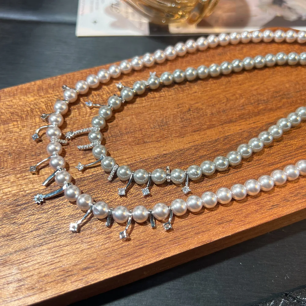 

Women New Zircon Pearl Necklace Feather Earrings