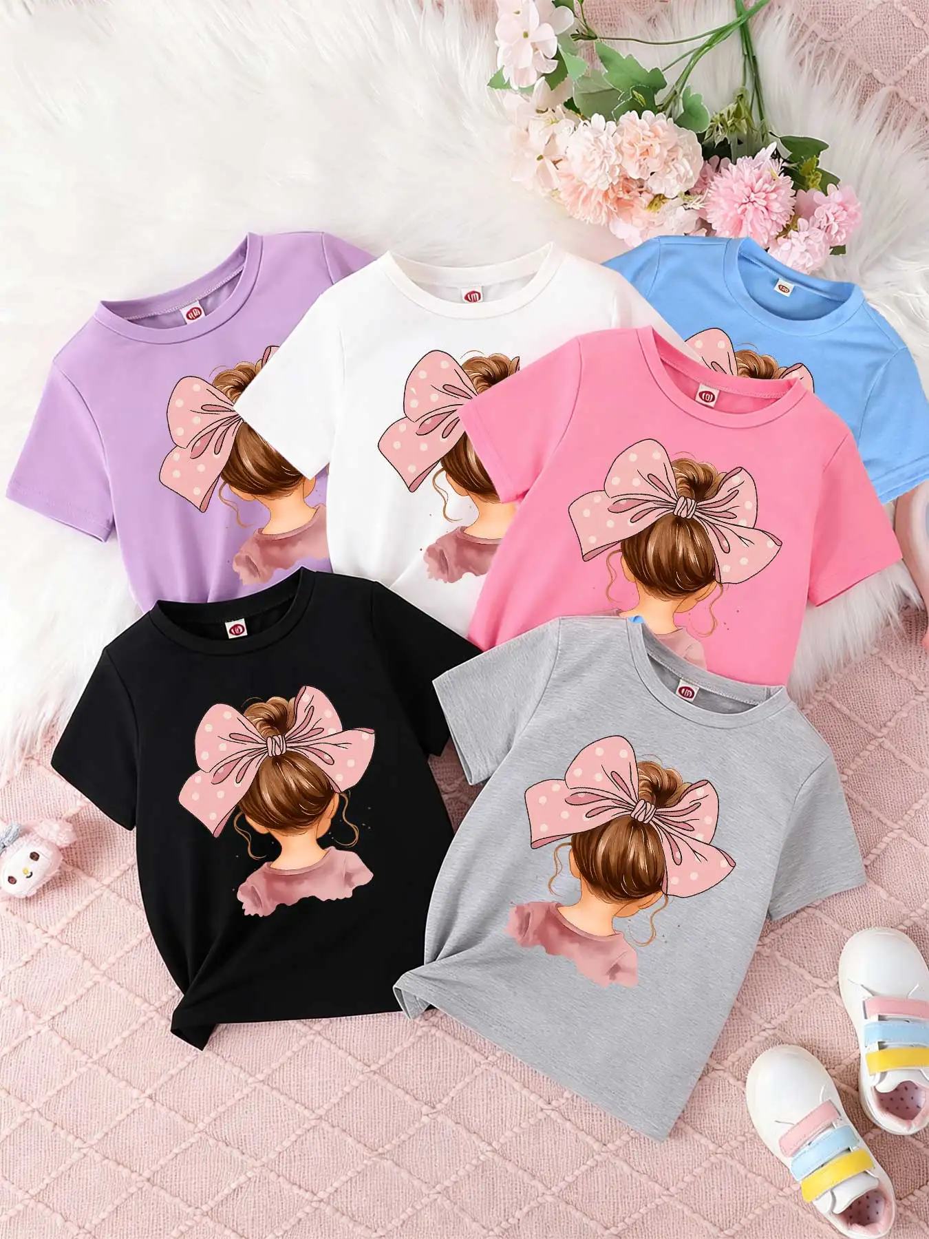 

Children's short-sleeved T-shirts for boys and girls, loose and breathable,cute girl back view, pink polka dot bow girl hair bow