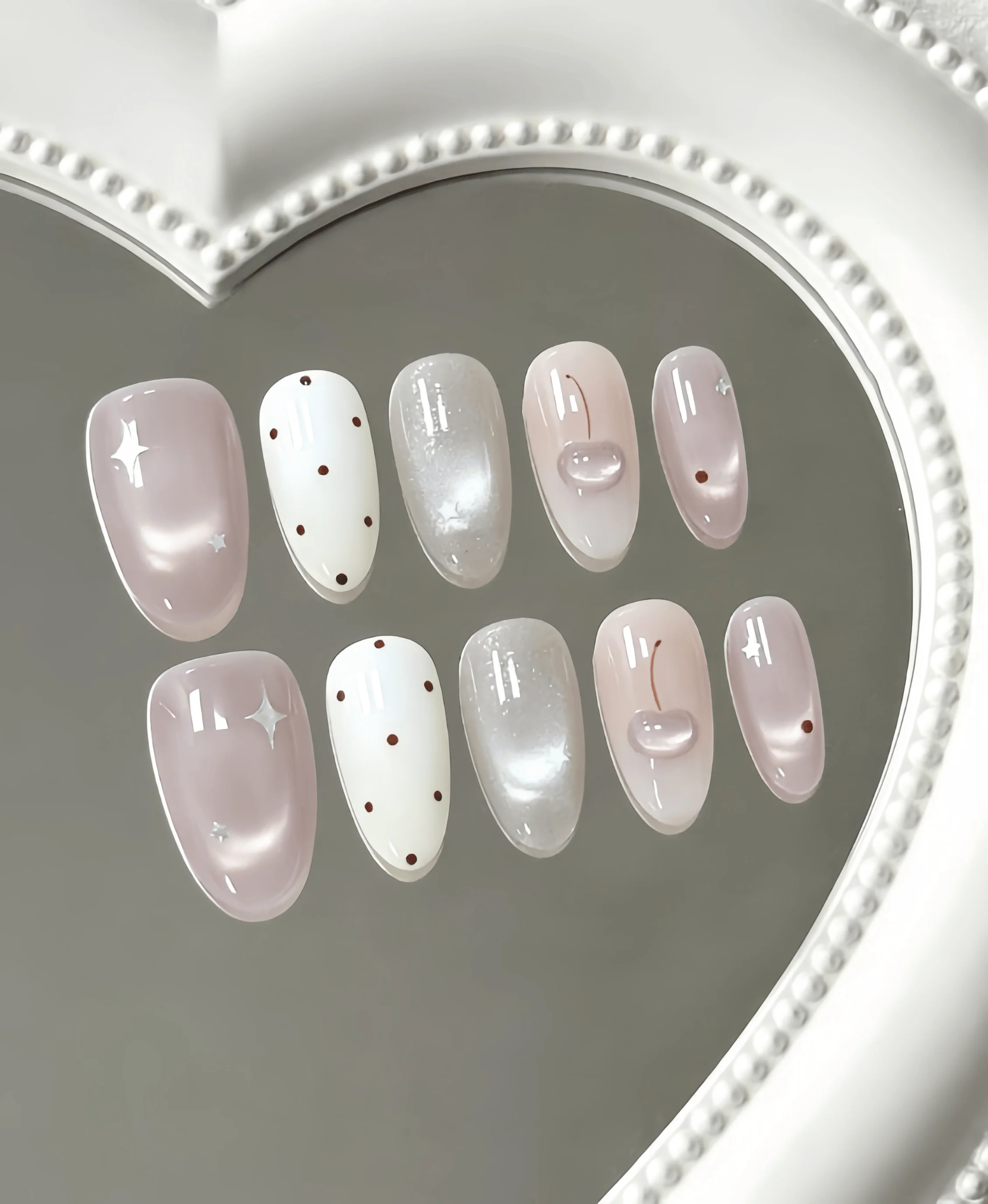 10 Pieces of Handmade Almond-Shaped Full-Cover Nail Tips, Medium Length, Pink and White Cherry Polka Dots, Soft and Sweet Style, Featuring 3D Cherry, Polka Dot, and Star Designs, Using Nude-Toned Cat Eye and 3D Decoration Techniques, Suitable for Girls during Graduation Season, Ideal for Summer Vacations, Suitable for Daily Commuting, Campus, and Cute Date Outings, Includes Jelly Glue and Nail File