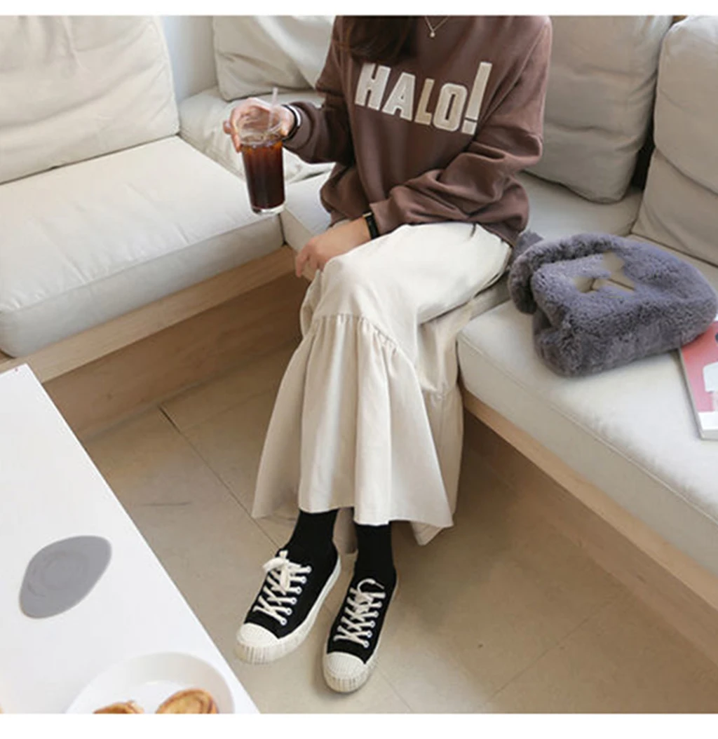 The loose, student-style, retro autumn corduroy fashion A-line all-in-one mid-calf apricot aesthetic skirt from Harajuku