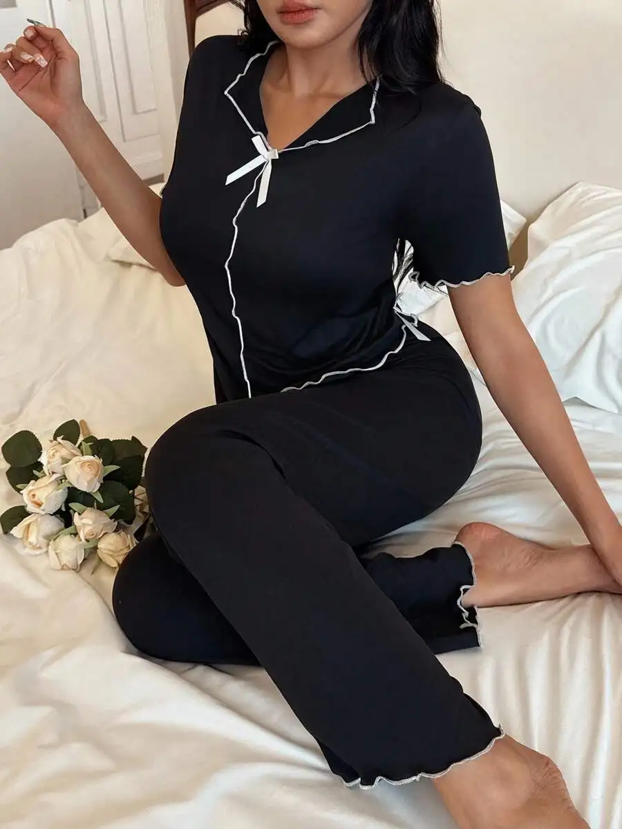 

Women's Black V-Neck Short Sleeve Pajama Set with White Bow and Ruffle Trim