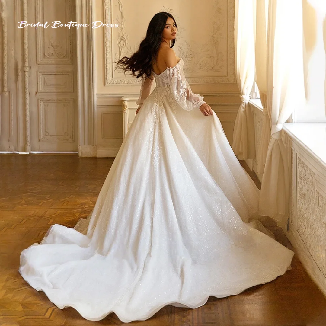 カスタマイズされたエレガントなAラインのウェディングドレスビーズレースアップリケ花嫁恋人バックレスパフスリーブプリンセスブライダルドレストレーン