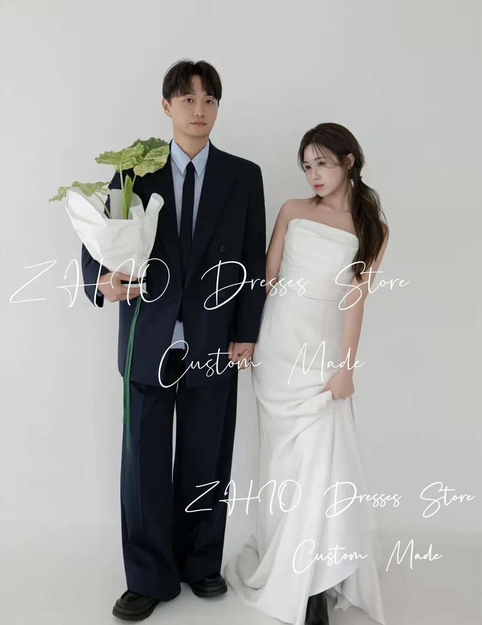 ชุดแต่งงานสีขาวเรียบง่ายแบบ ZHIO สายเดี่ยวทรงคอร์เซ็ท ทรงเอไลน์ ชายกระโปรงยาวแบบสวีปเทรน สไตล์เกาหลี สำหรับถ่ายภาพงานแต่งงานและงานเลี้ยงฉลอง สามารถสั่งตัดได้