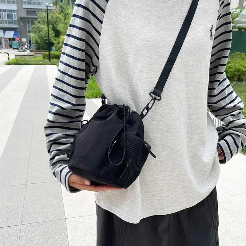 Light Purple Nylon Drawstring Crossbody Bag With Adjustable Strap Mesh Pocket For Daily Use Shopping Trips