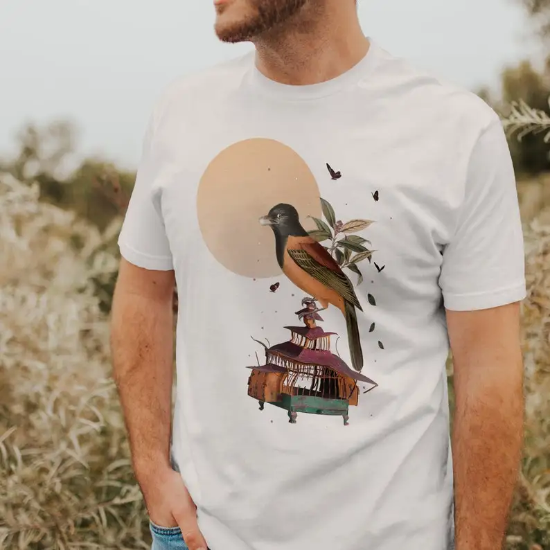 Graphic, original, colorful shirt with a cute bird illustration and a message about freedom.