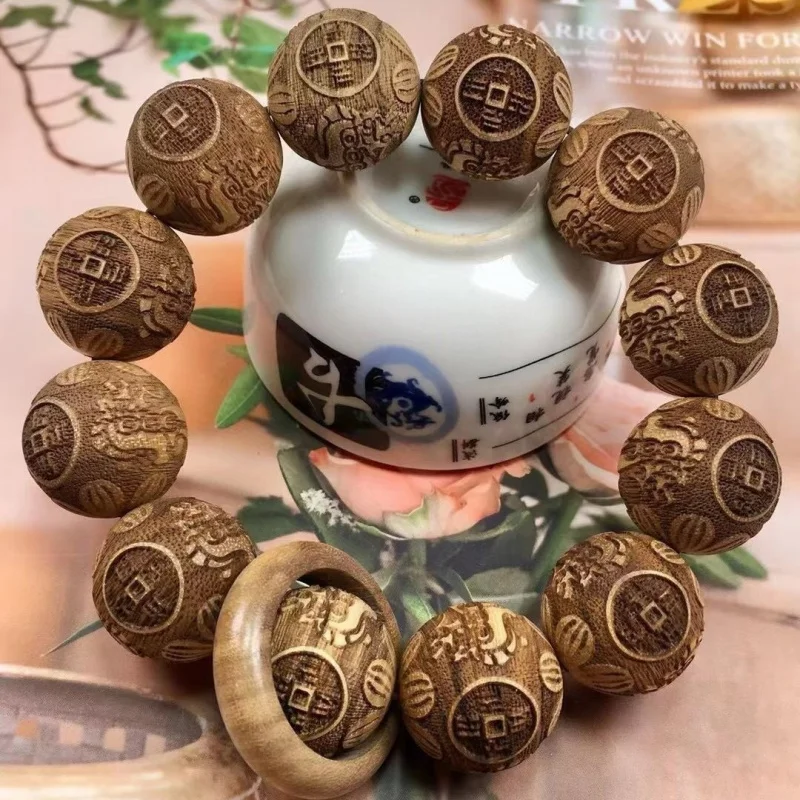 

Papuan milky wood 20mm round bead with sliding ring, unisex cultural and collectible bracelet prayer beads