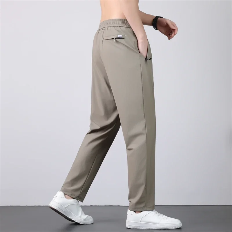 رقيقة تنفس السراويل الرجال 7XL الحرير الجليد الصيف التجفيف السريع فضفاض مستقيم مرونة عالية السراويل الرياضية الركض سراويل تقليدية