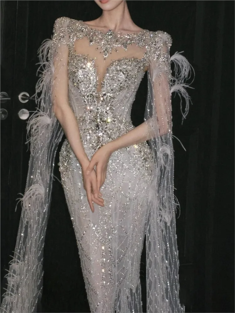The host will toast beaded strapless and models walk runway with shawls girl wear a dress