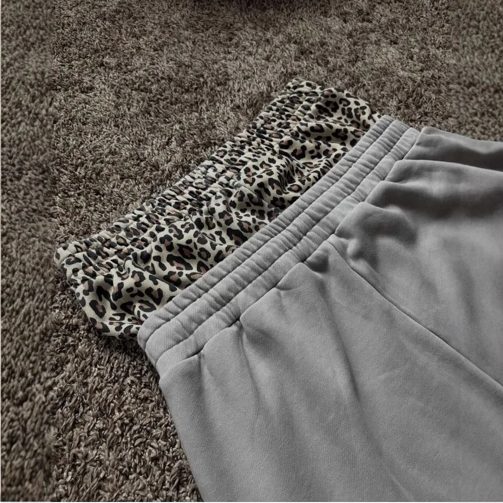 ヨーロッパとアメリカのレトロトレンド、ゆったりとしたカジュアルなパッチワーク、ヒョウ柄、ダブルウエスト、フェイクツーピーススポーツパンツ、ファッショナブルなY2K