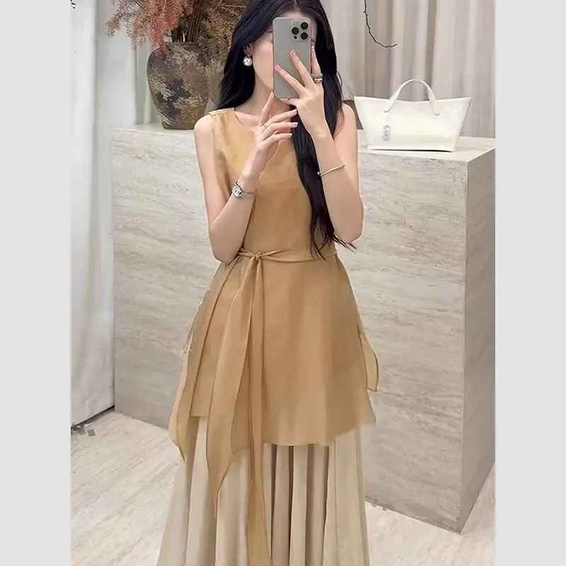 Nuevo conjunto pequeño y fragante de lujo de dos piezas para mujer, moda de verano, blusa sin mangas con cordones, Top + falda larga acampanada, traje elegante