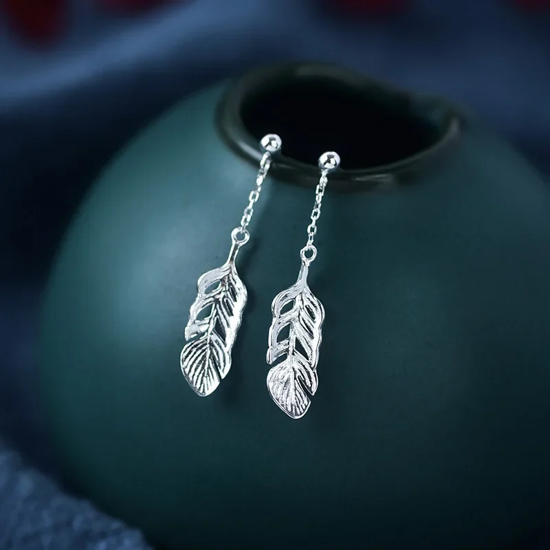 

Женские серьги из серебра 925 пробы с перьями