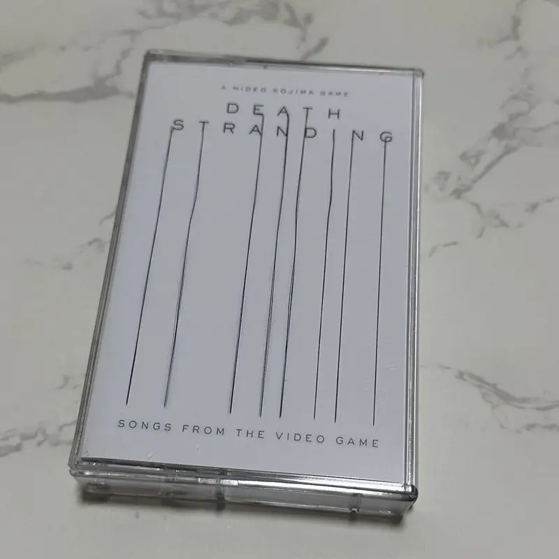 

Музыкальная кассета из видеоигры Death Stranding. Совершенно новый, нераспечатанный коллекционный саундтрек.
