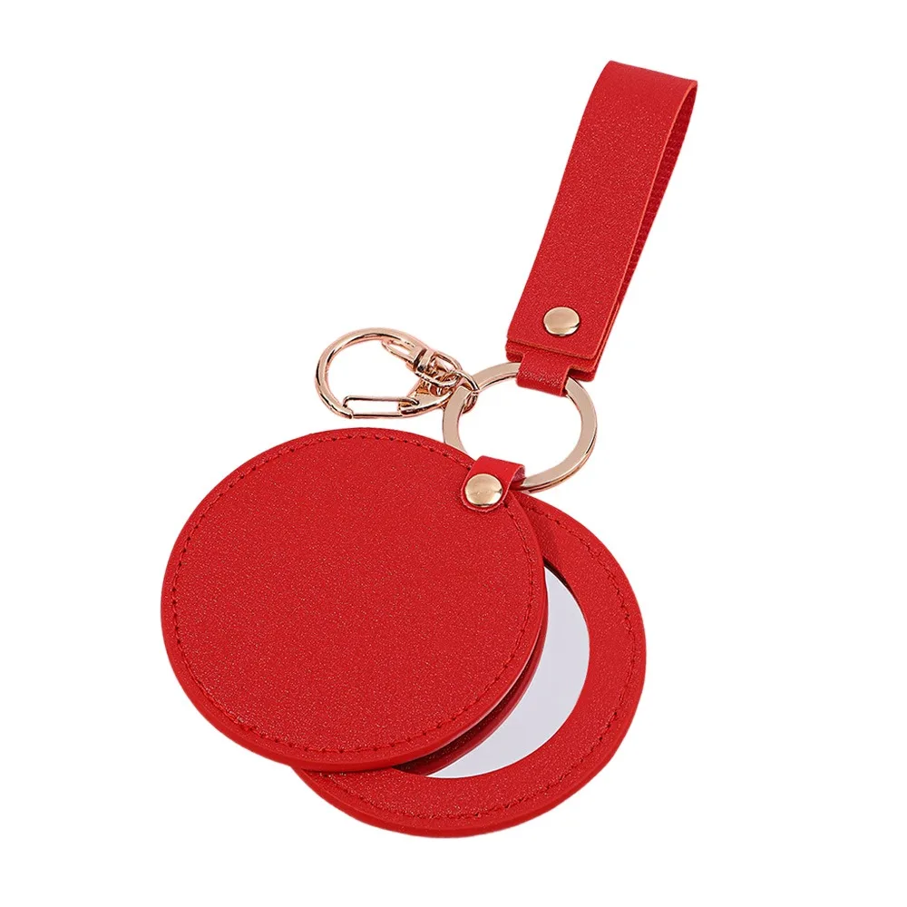 Mode PU-leer kleine make-upspiegel Ultradun lichtgewicht schattige kleine spiegel Draai ronde draagbare reisspiegel Zakformaat