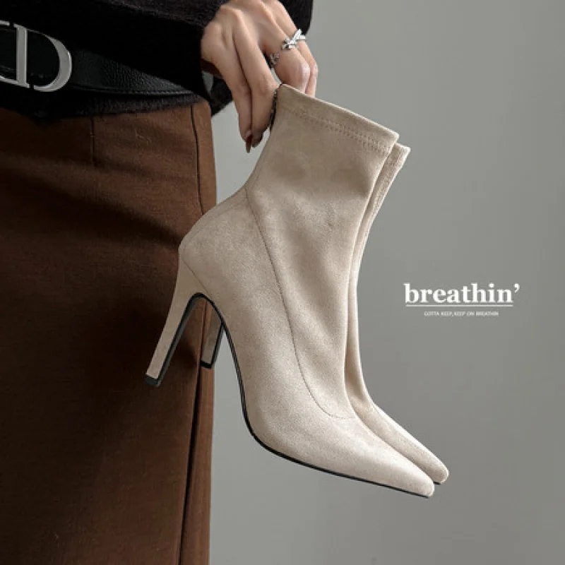 

Sleek Stiletto Boots featuring a Stretch Fit and Pointed Toe