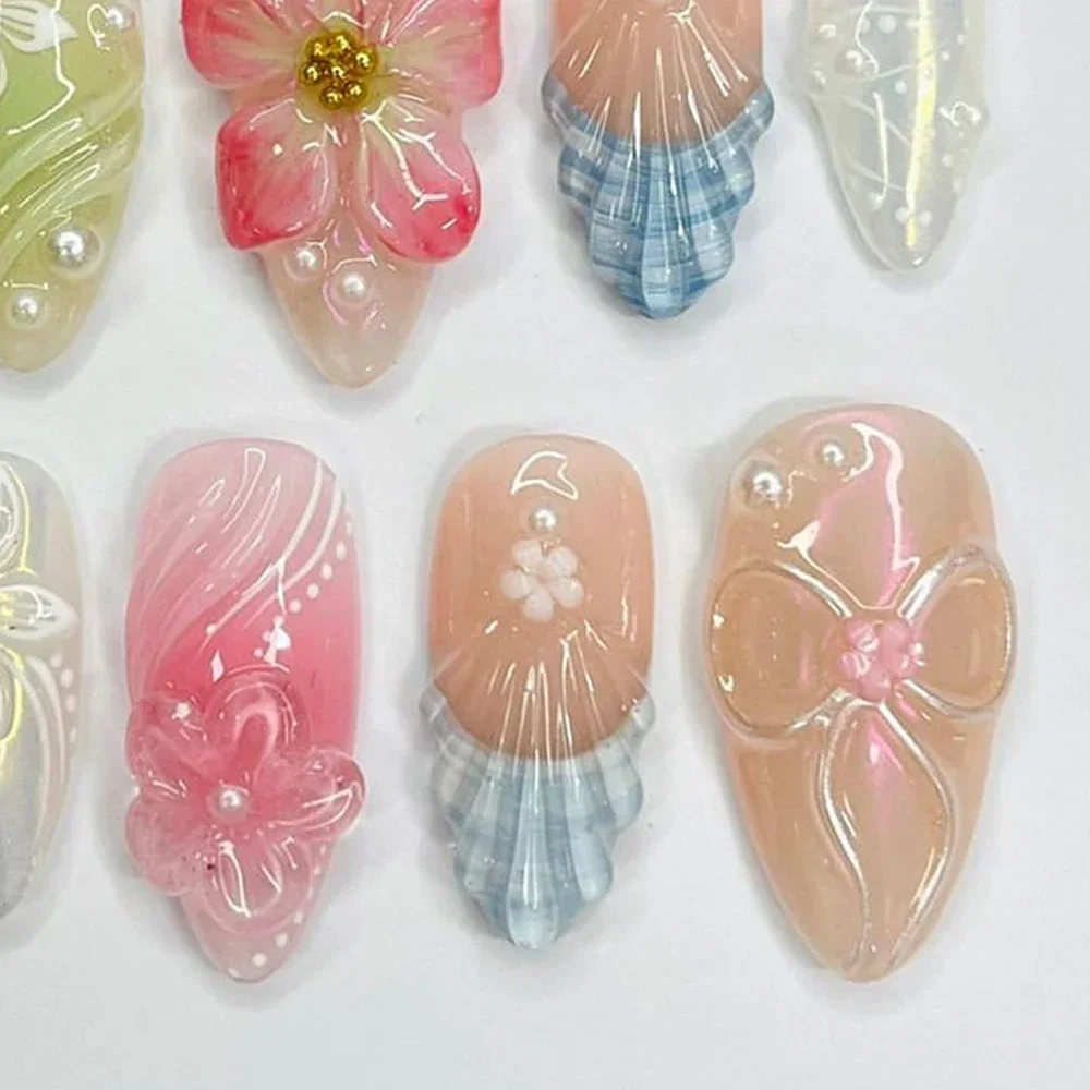 2024 Vendita calda 3D Shell Gel Lavoro manuale Unghie finte Fiori di giglio Aurora Rosa Mandorla Stampa sulle unghie Art Party Sticker Regalo personalizzato