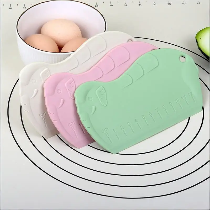 A Graduated Plastic Dough Scraper, A Convenient And Practical Kitchen Plastic Tool