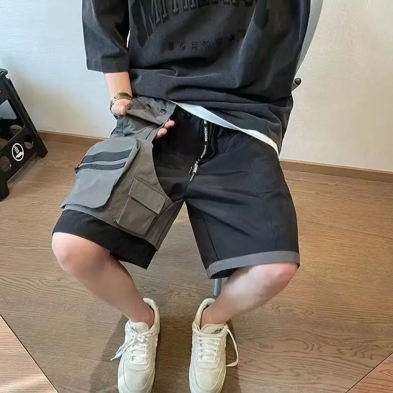 Pantalones cortos de trabajo de dos piezas con Bolsillo falso salvaje para hombre, pantalones sueltos de cinco pantalones, ropa de calle de