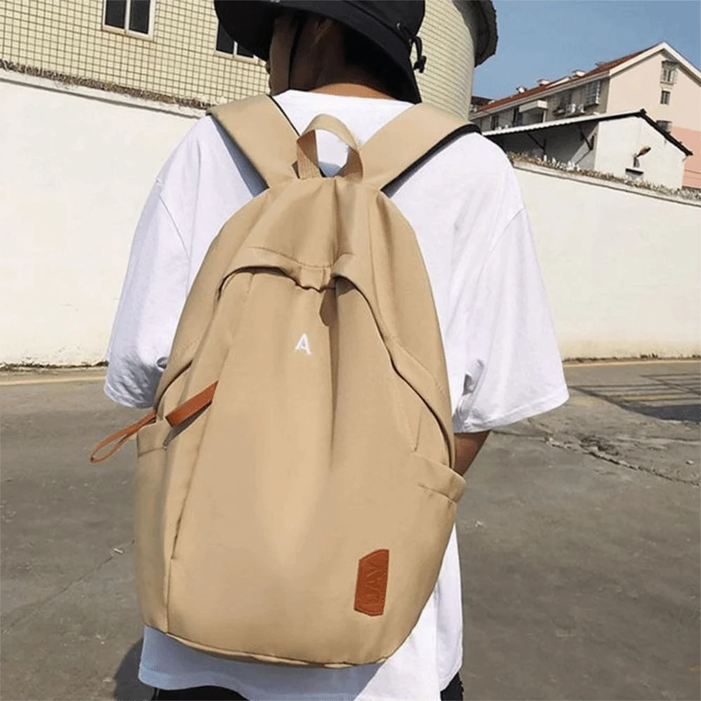 حقيبة ظهر جامعية من القماش متعددة الاستخدامات بلون سادة مقاومة للماء للسفر حقيبة كتف ذات سعة كبيرة للمشي لمسافات طويلة
