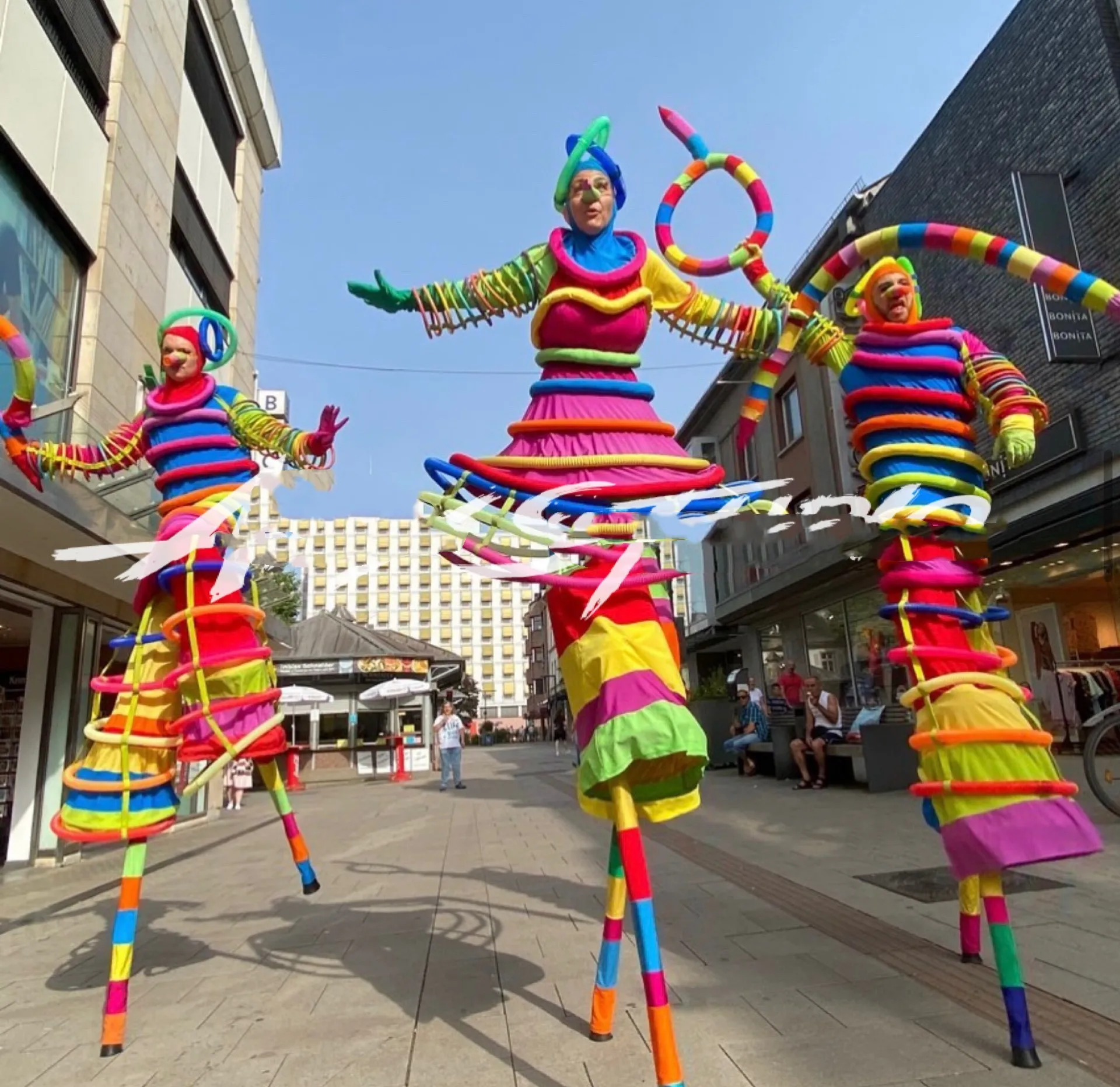 Amusement park tour interactive stilts colorful clown party atmosphere bar costume