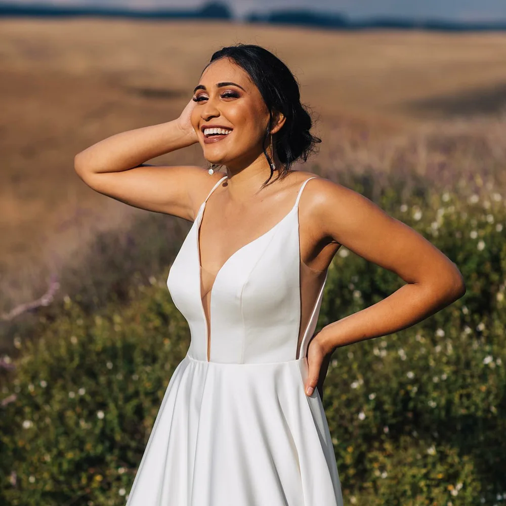 2025 Satin Wedding Dresses Deep V Neck A Line Backless Sexy Spaghetti Strap Bridal Gown Outdoor Women Bride Dress Customized