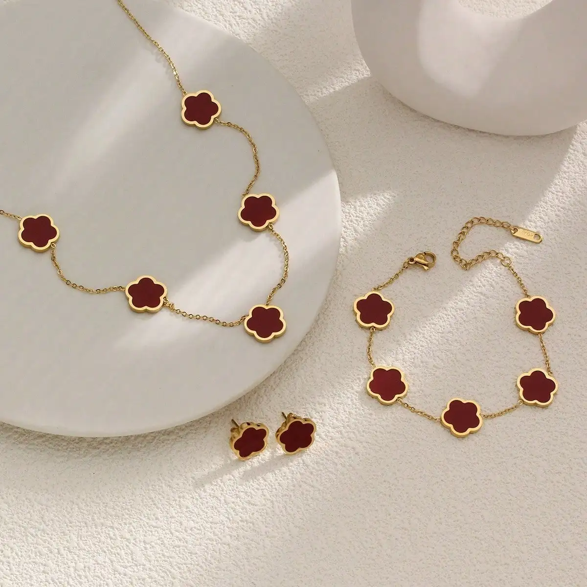 

3-Piece Red Clover Jewelry Set: Necklace, Bracelet & Stud Earrings in Gold Tone for Women