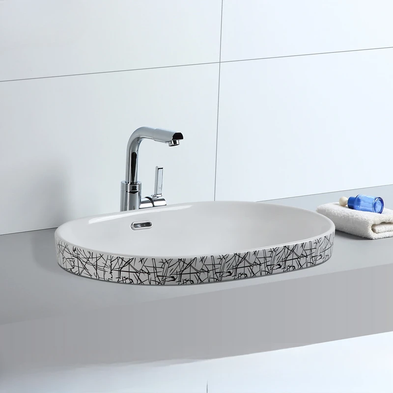 

Semi embedded washbasin, ceramic countertop, basin in the middle, household washbasin, oval shaped washbasin, washbasin