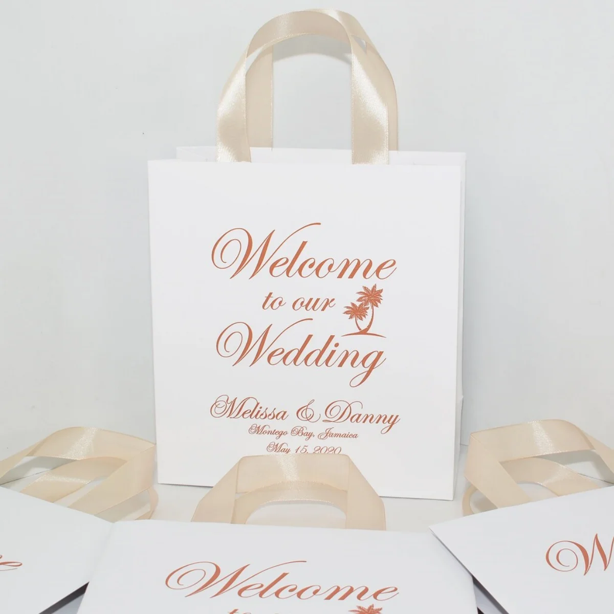 Destination Wedding Welcome Bags with satin ribbon handles. Tropical wedding favor. Elegant Rose Gold Personalized gifts for gue