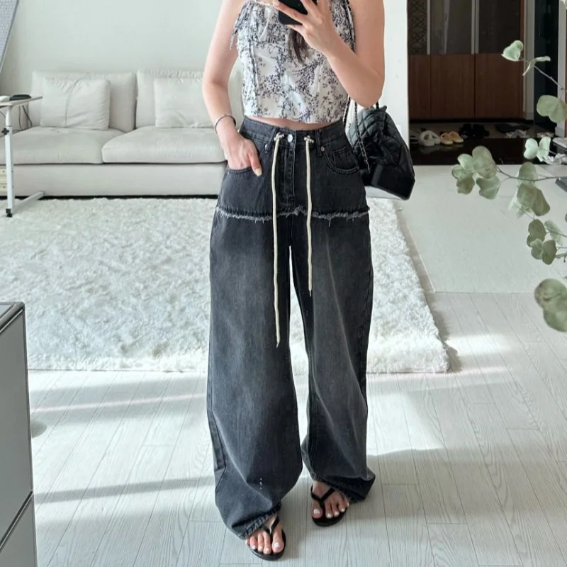 

Stylish women's wide-leg pants with patchwork and raw edges2025YearinsSlimming drawstring design jeans make legs look longer