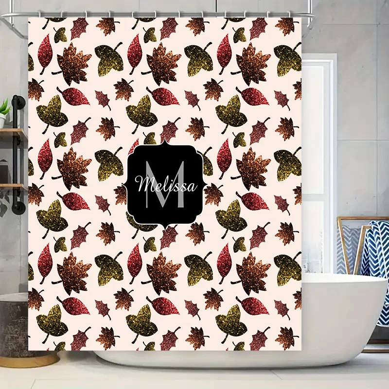 

Personalized shower curtain featuring autumn leaves pattern with glittery finish, custom name monogram in black font customizabl
