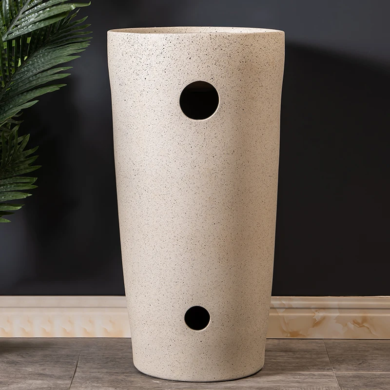 Ceramic vertical washbasin for household use