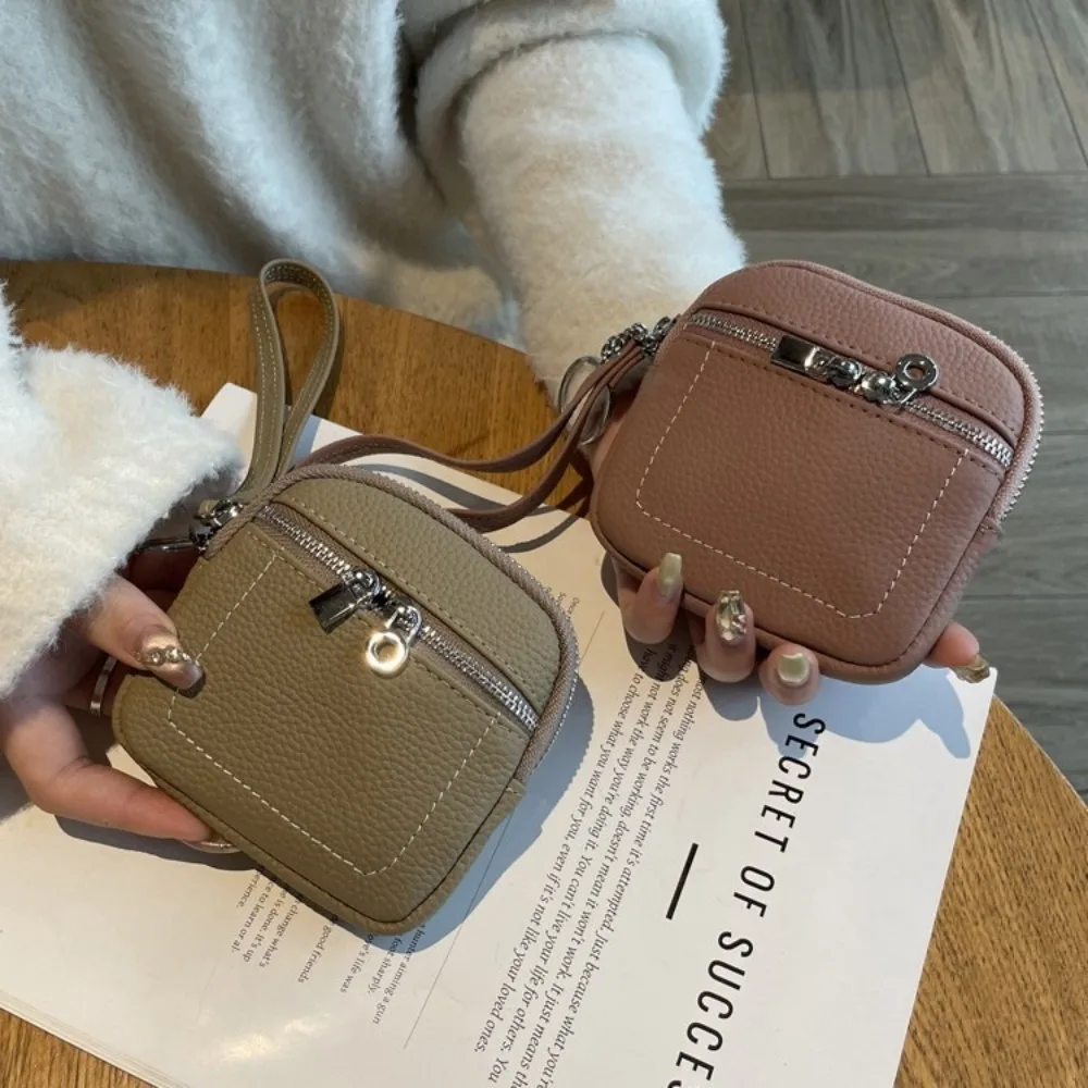 แฟชั่นซิปกระเป๋าใส่เหรียญหนัง PU พร้อมเชือกเส้นเล็กกระเป๋ารายการขนาดเล็กน้ําหนักเบาสีทึบลิปสติกหูฟังกระเป๋า